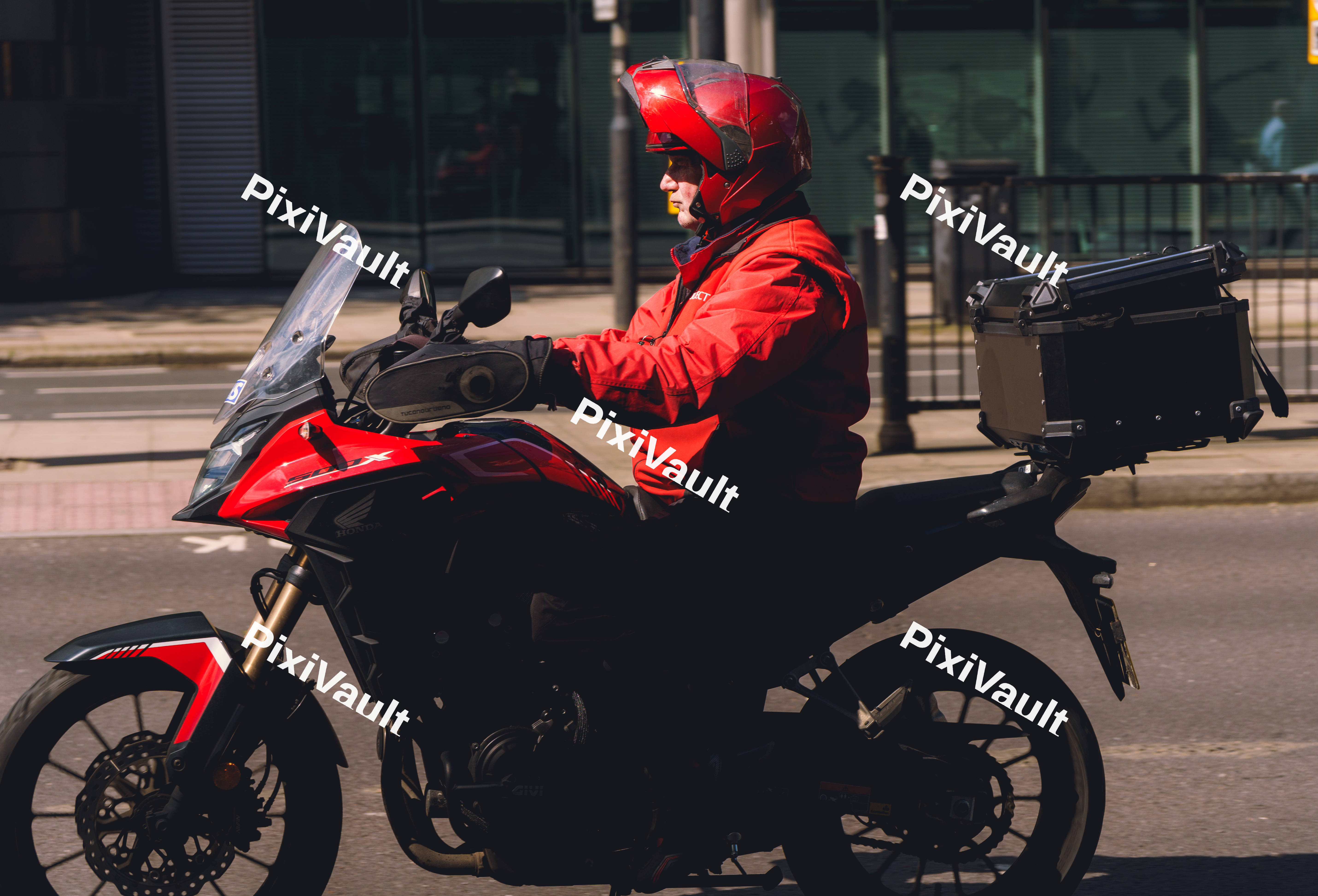 Man In Red On Motorcycle
